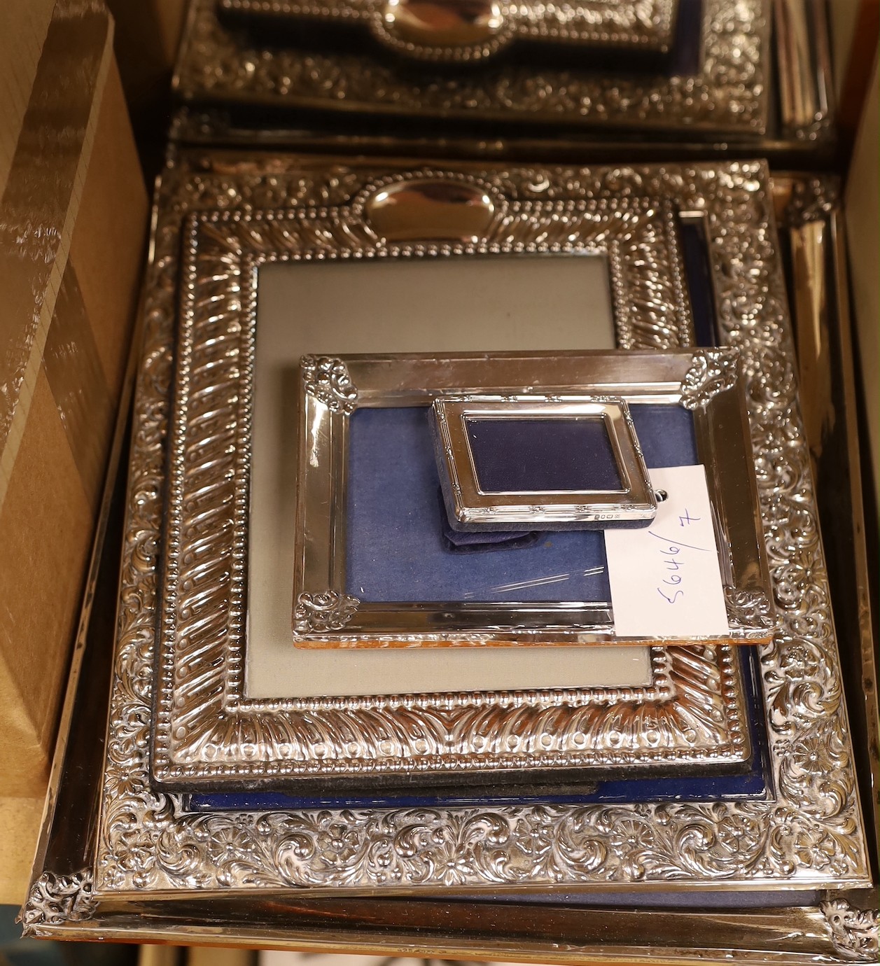 A collection of silver and silver plated photo frames